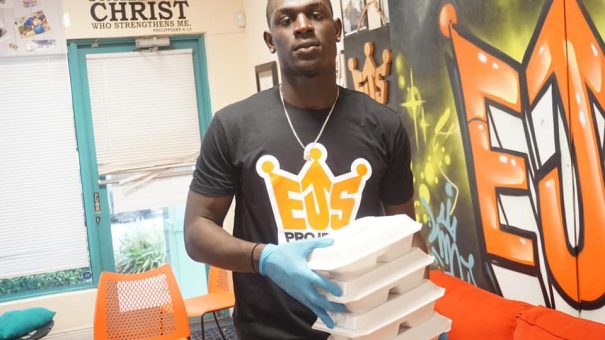 man with food for others