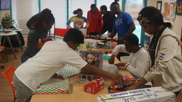 volunteers with toys